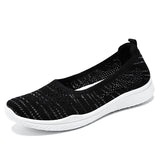 Breathable Flyknit shoes with soft soles, slip-on design.